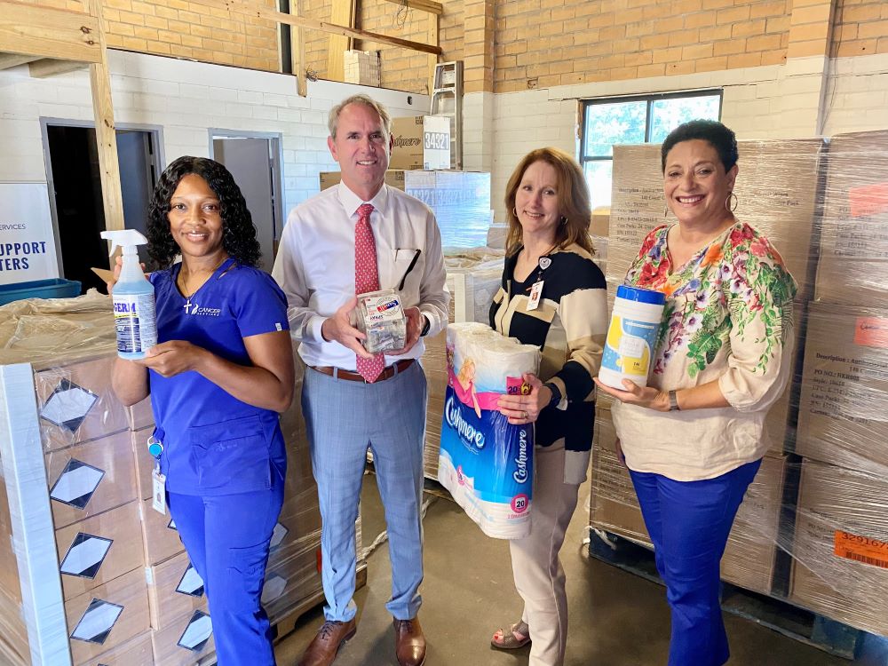 Shawnda Barrow, client services liaison, Cancer Services; Manard Lagasse, Jr., President and CEO, Associated Grocers, Inc.; Nancy Gosserand, director, Cancer Services; Renea Duffin, vice president, cancer support and outreach, Mary Bird Perkins Cancer Center