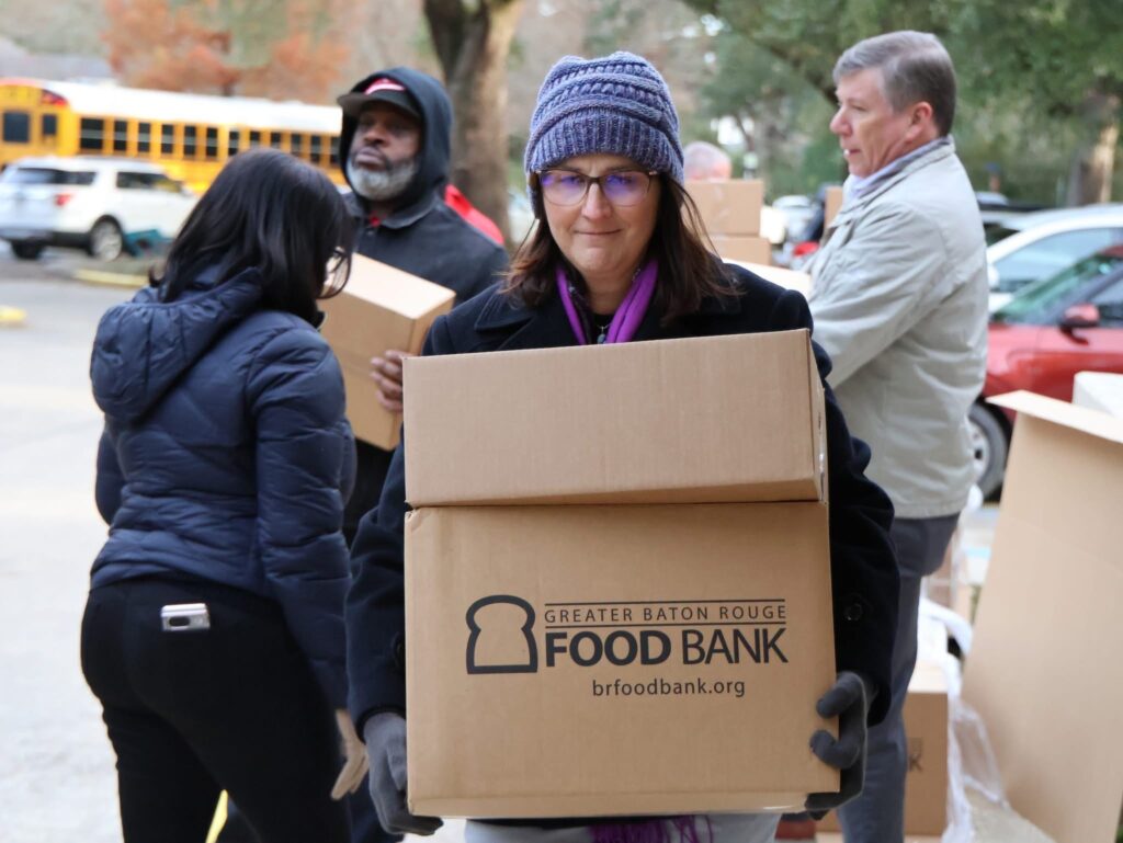 Carrying boxes of food for families
