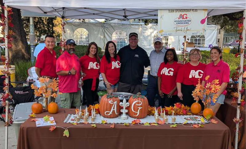 Associated Grocers team members gather at the AG booth during the United Way Jambalaya Jam in downtown Baton Rouge.
